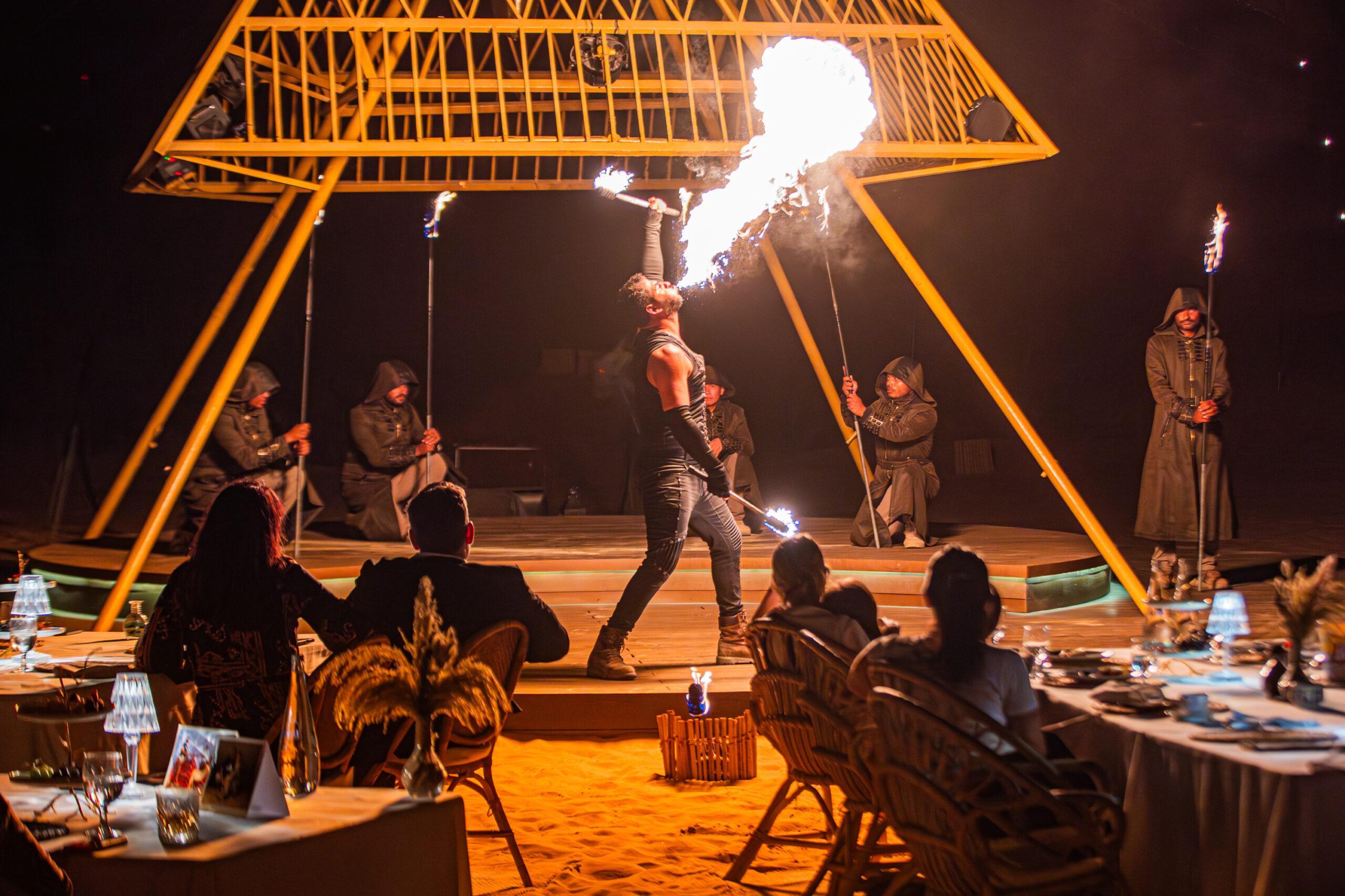 Sonara Camp — outdoor dining platform and Hajar Mountains, Hatta Dubai